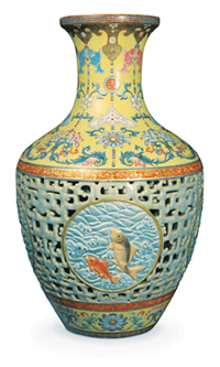 An extremely rare and important 18th-century Qianlong reticulated porcelain ovoid vase decorated with famille rose and famille jaune enamels, that set a new world record for a Chinese work of art when it sold at Bainbridge's London auction rooms for 51.6 million pounds ($83.2 million), including buyer's premium. Image courtesy Bainbridge's.